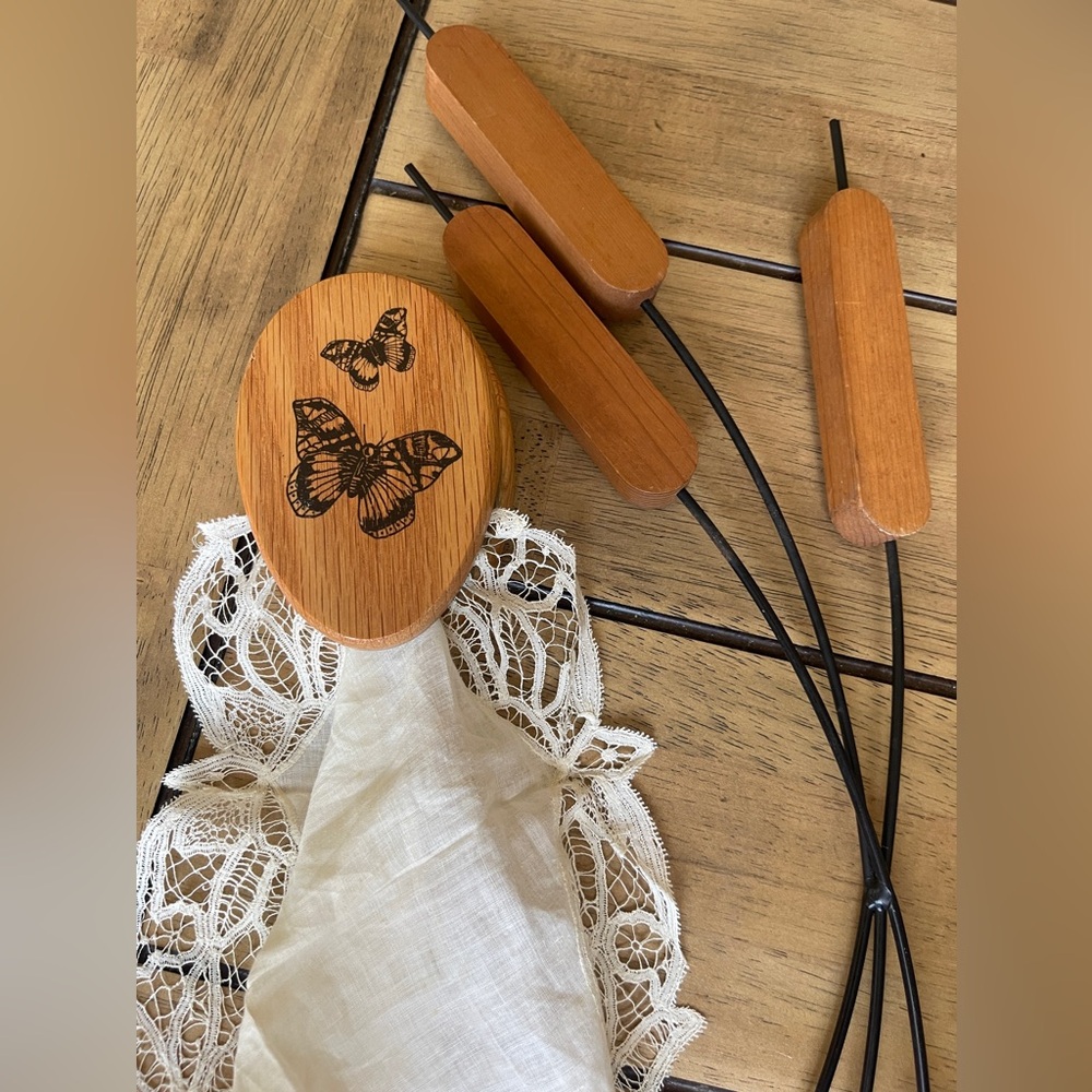 Boho vintage wooden butterfly towel holder and cattail wall decor.